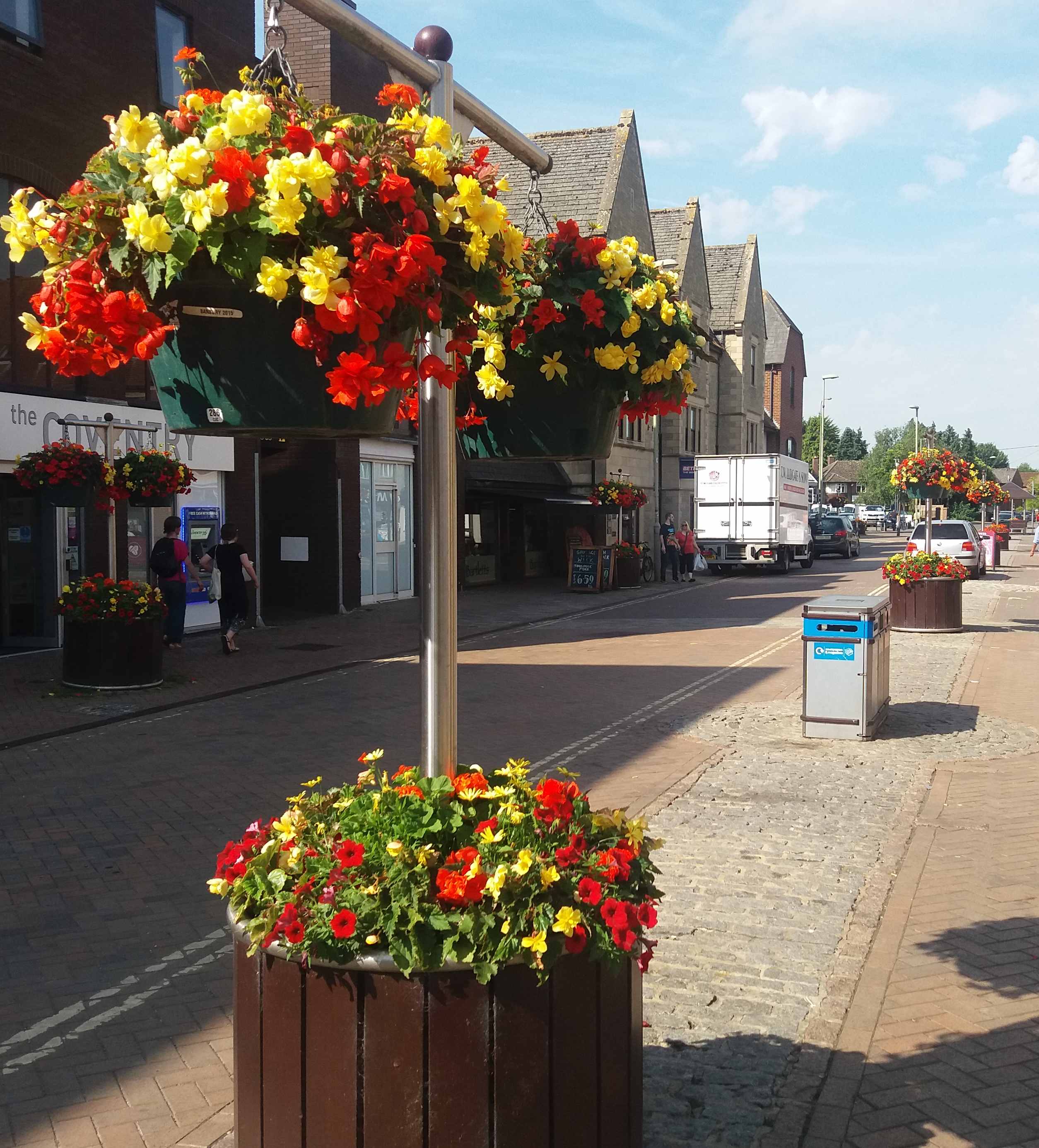 high street with yellow and red flowers